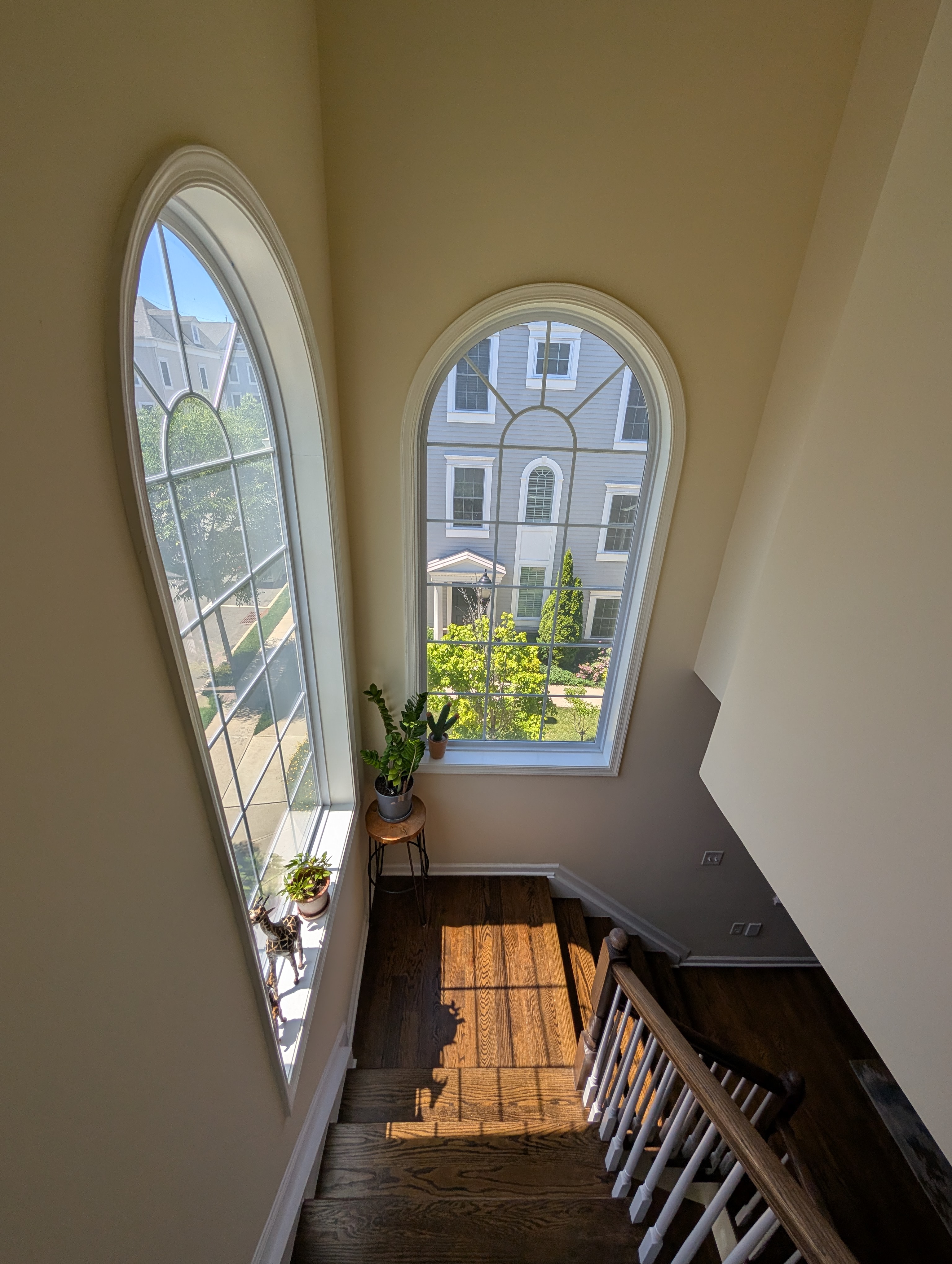 Grand staircase with twin arched windows